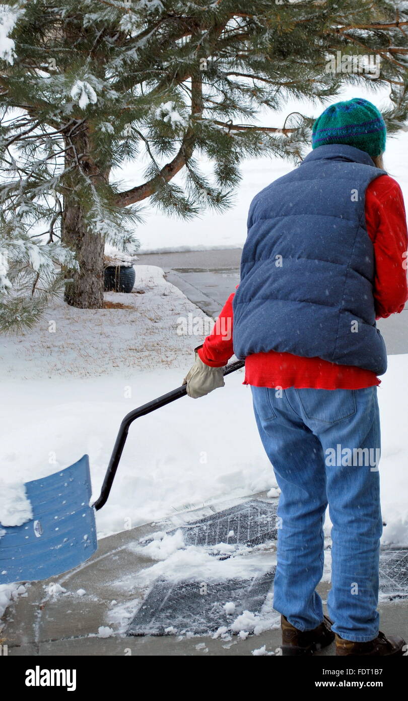 Woman shoveling snow hires stock photography and images Alamy