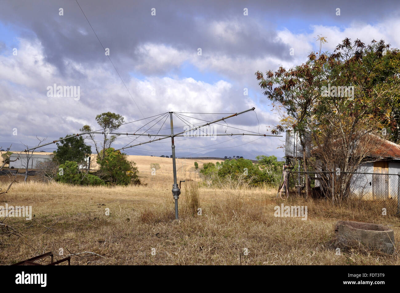 Old Hills Hoist clothes line stands abandoned besides a historical old  homestead Stock Photo - Alamy