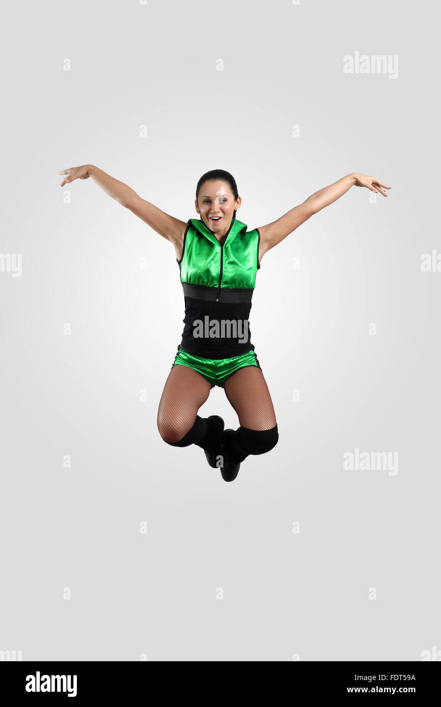 Young female dancer jumping against white background Stock Photo - Alamy