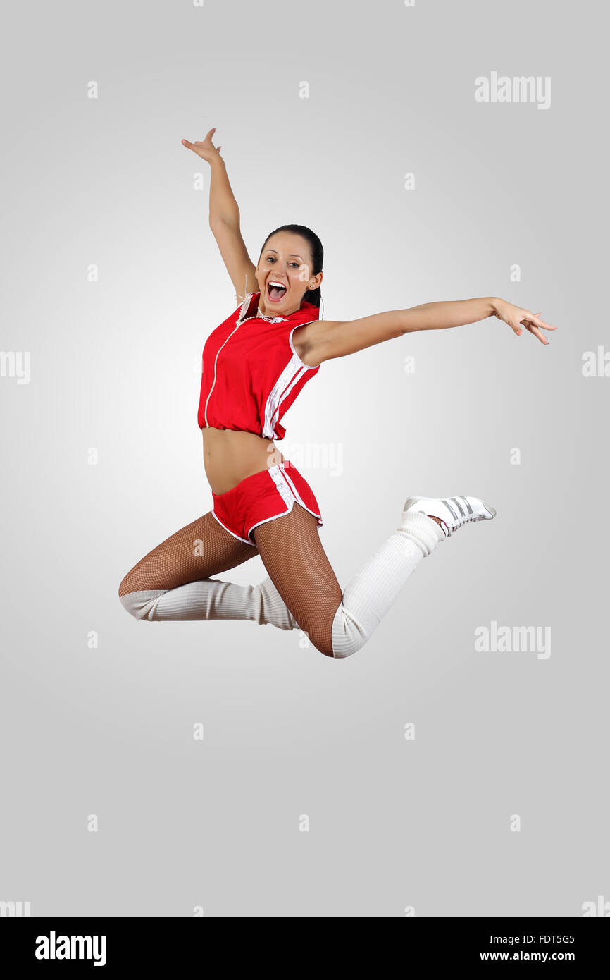 Young female dancer jumping against white background Stock Photo - Alamy
