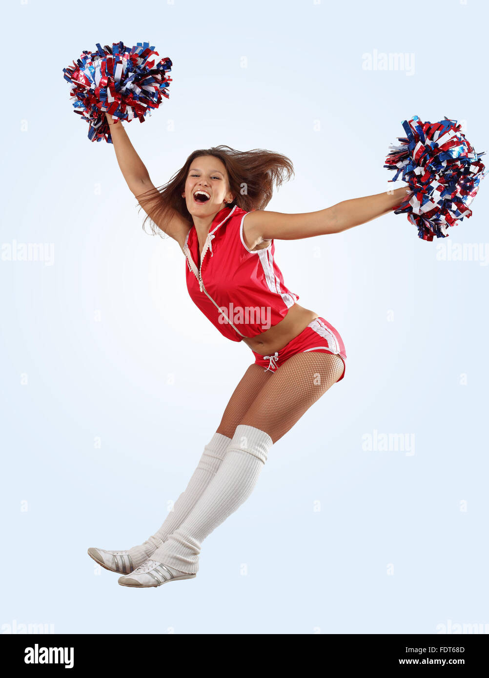 Cheerleader Jumping with Pom-Poms Stock Photo - Image of energy