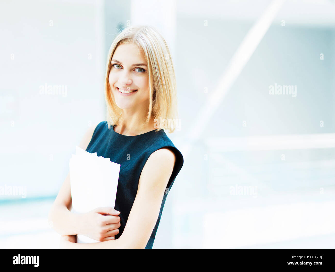 A portrait of a young business woman in an office Stock Photo - Alamy