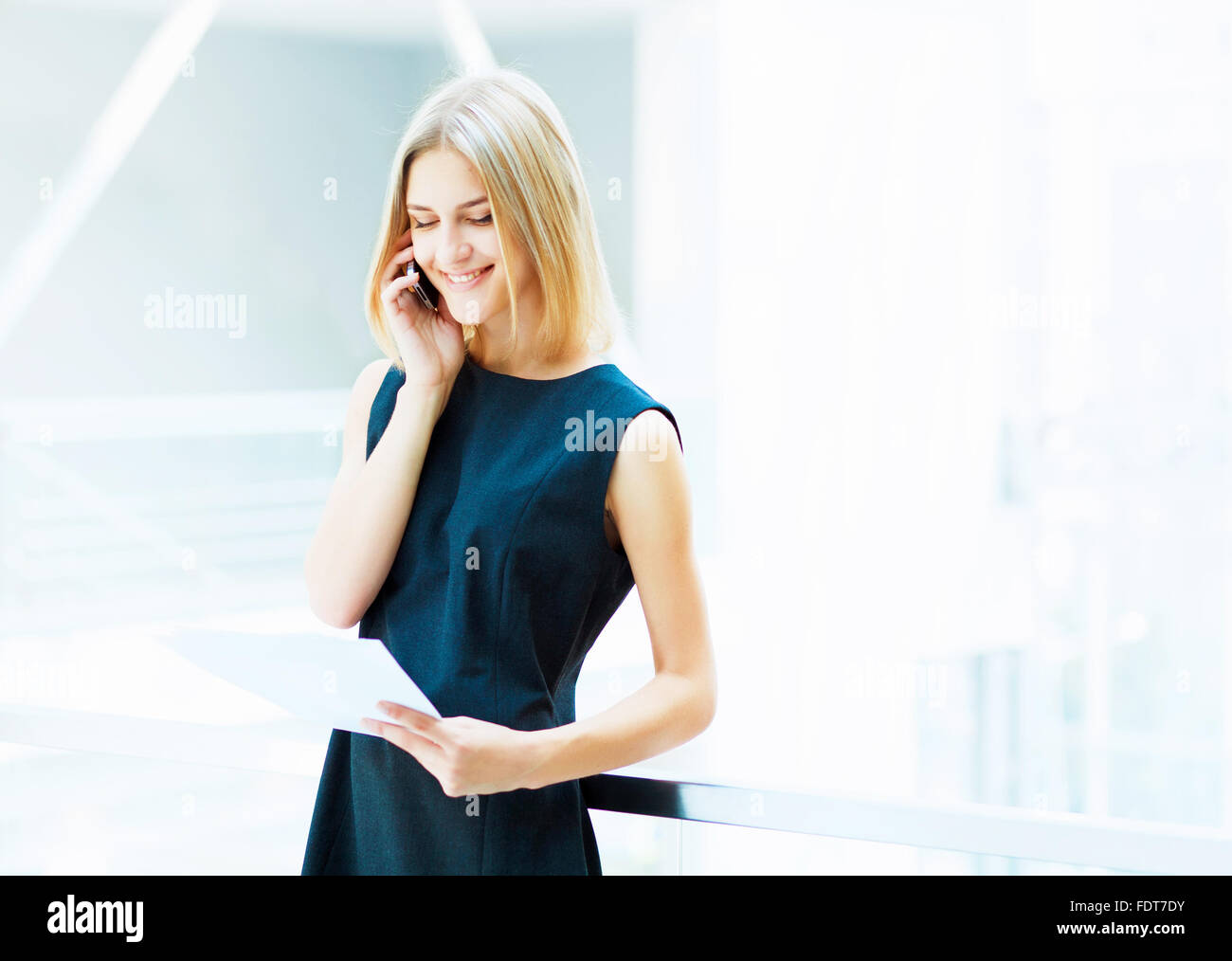 A portrait of a young business woman in an office Stock Photo - Alamy
