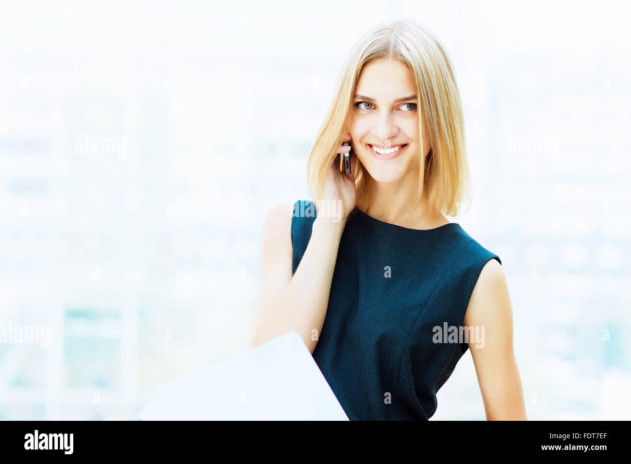 A portrait of a young business woman in an office Stock Photo - Alamy