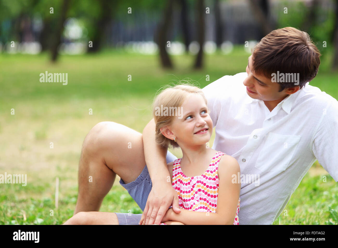 A dad and his daughter are together in the park Stock Photo - Alamy