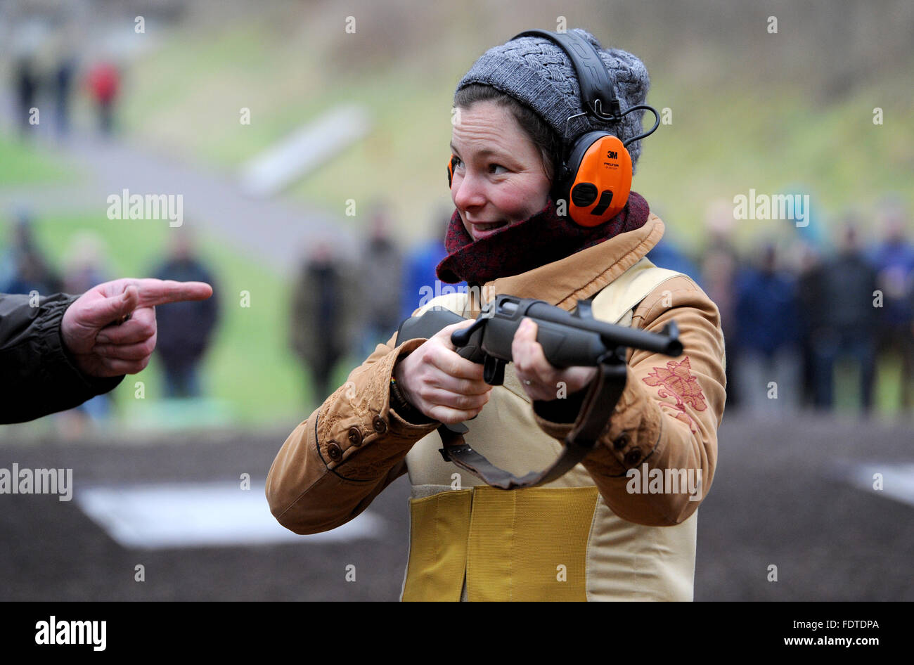 Altenwalde, Germany. 28th Jan, 2016. An Arctic reasearcher is instructed by a shooting instructor at a shooting range in Altenwalde, Germany, 28 January 2016. Scientists of the German Alfred-Wegener-Institute for Arctic- and Ocean Research (AWI) are taught how to use rifles to defend themselves against polar bears before they are sent to their expeditions. The use of the rifle is meant as a last resort in case of an attack by polar bears. Photo: INGO WAGNER/dpa/Alamy Live News Stock Photo