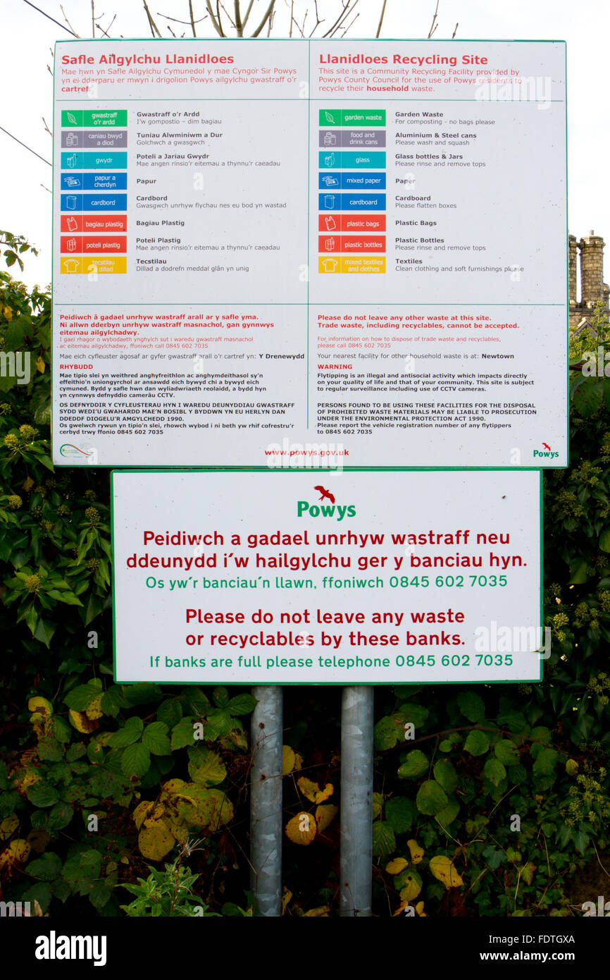 Recycling - bilingual English/Welsh sign outside a recycling centre. Llanidloes, Powys, Wales. October. Stock Photo