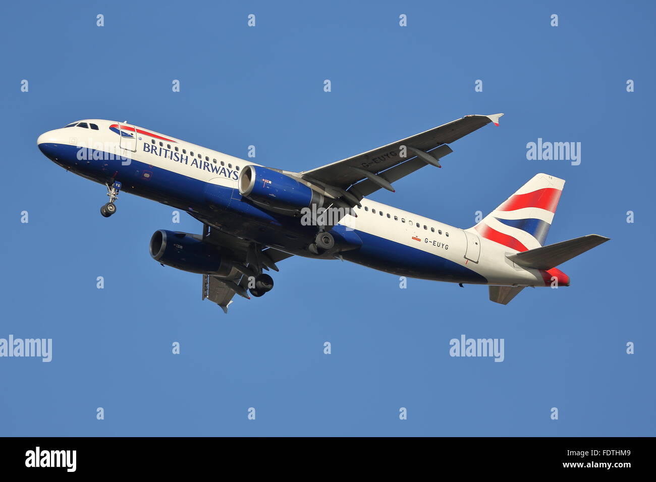 British Airways Airbus A320-200 G-EUYG landing at London Heathrow Airport, UK Stock Photo