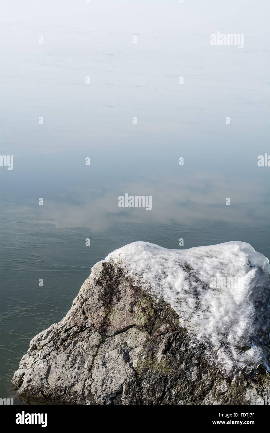 Polar Roks Ice Creem Frozen rocks with ice in the winter lake Stock Photo - Alamy