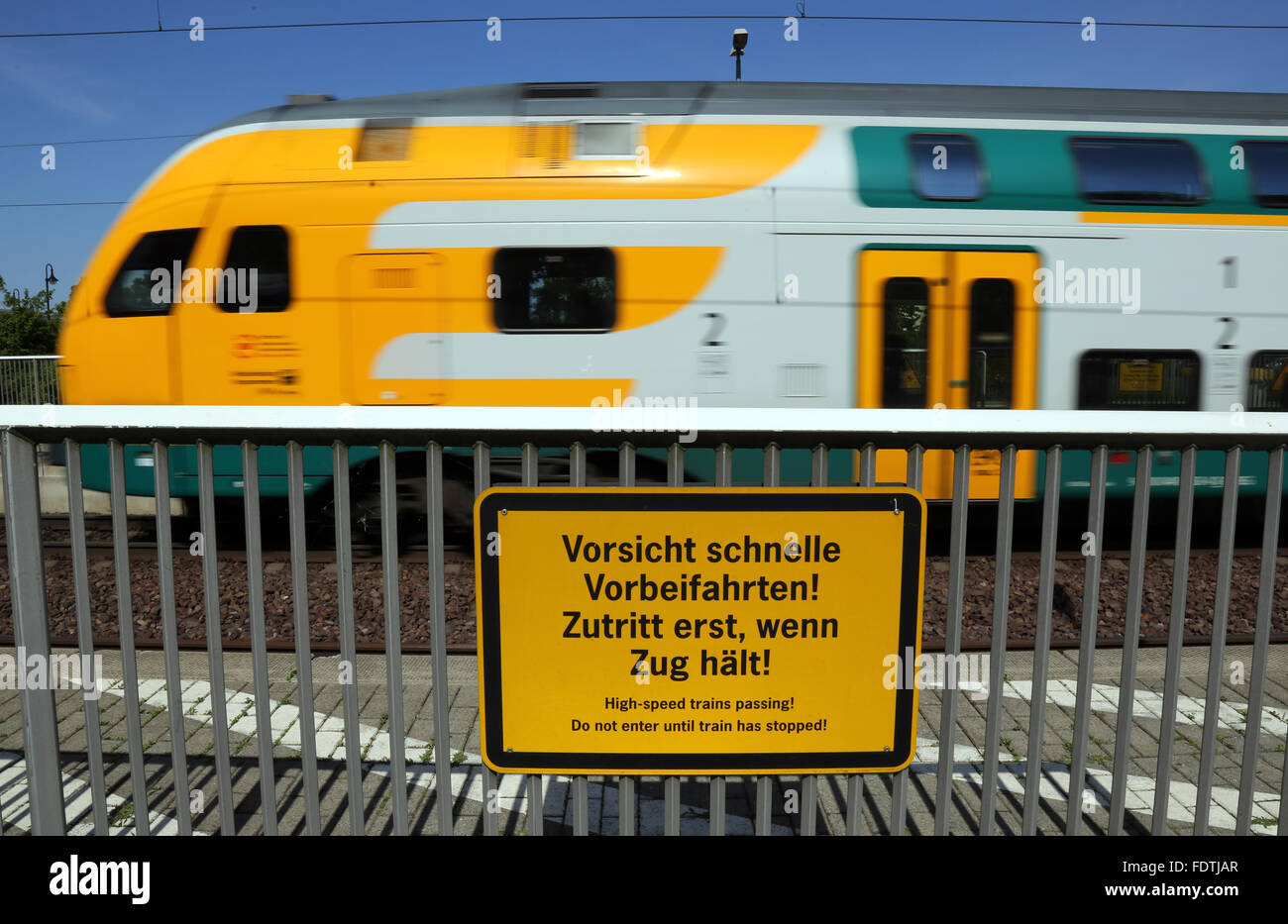 Neustadt (Dosse), Germany, Warning Sign -Vorsicht, fast Vorbeifahrten- on the platform Stock Photo