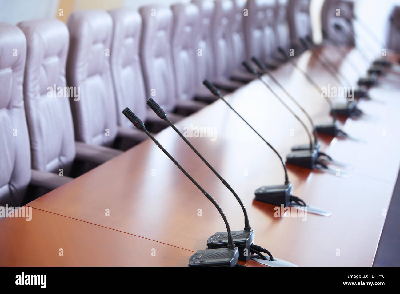 before a conference, the microphones in front of empty chairs Stock ...