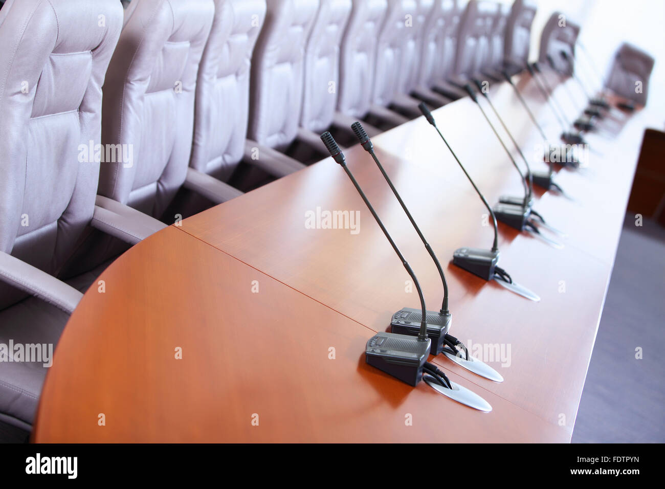 before a conference, the microphones in front of empty chairs Stock ...