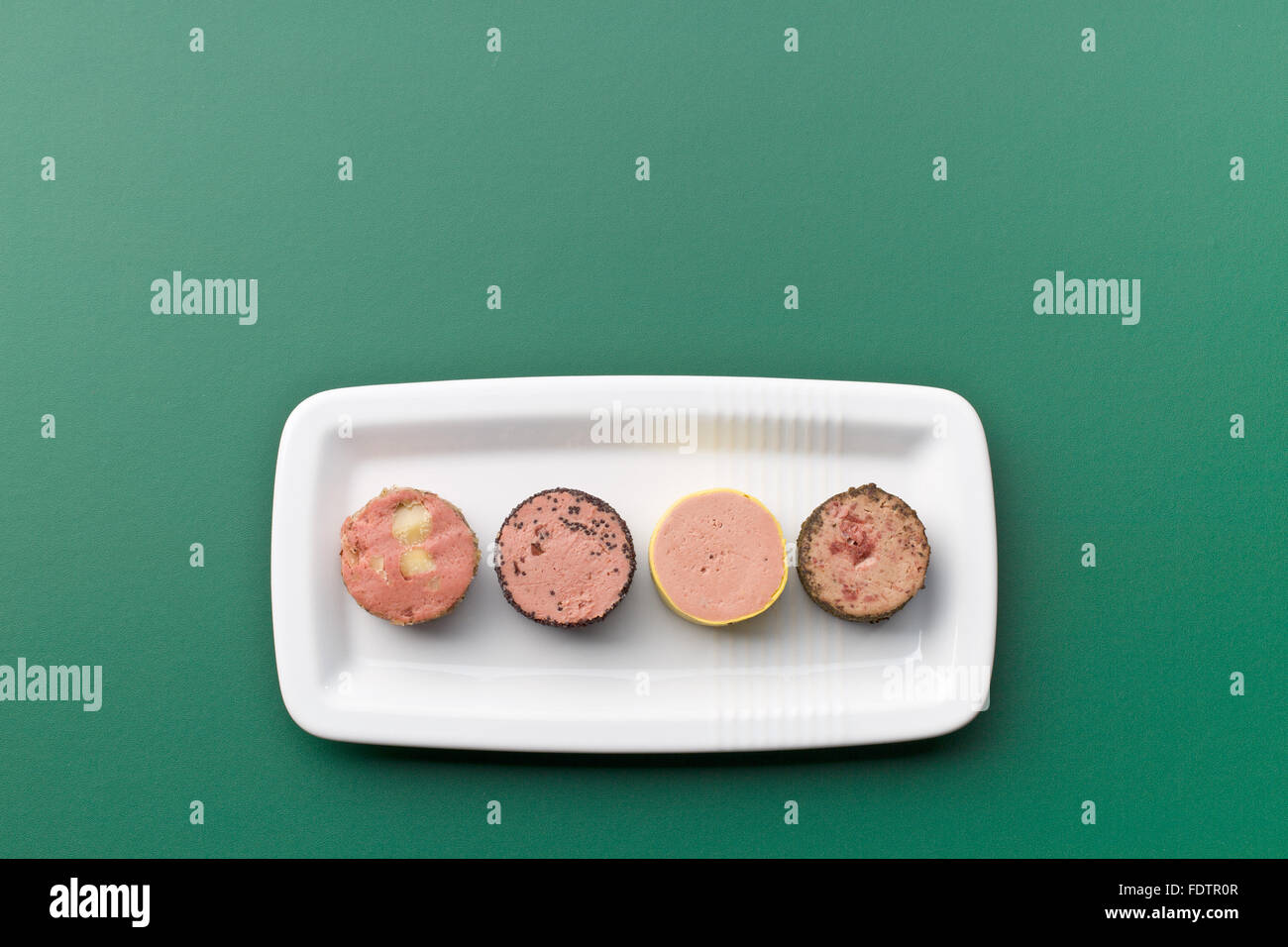 meat pate with different flavors on chalkboard Stock Photo