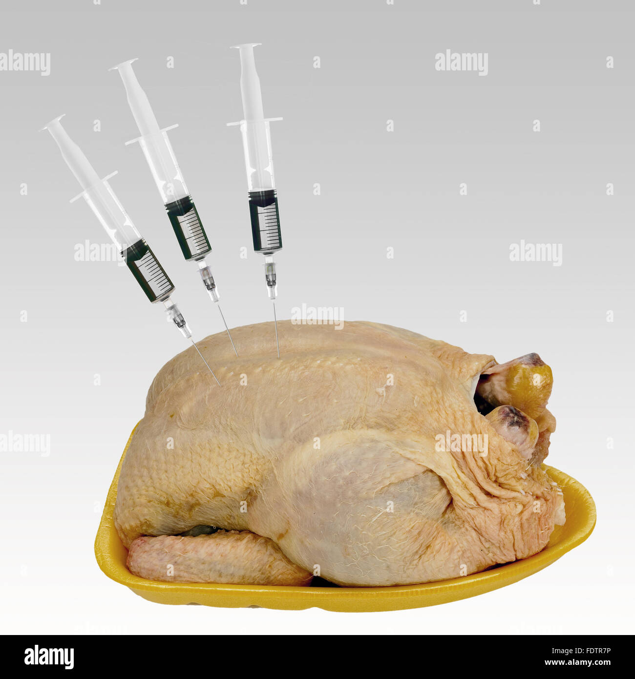 Water added to meat - food scandal.Chicken. Stock Photo