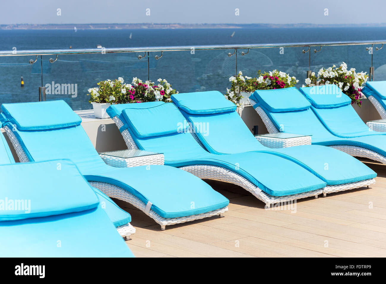 View summer comfortable cafe in a recreation area on the beach with a swimming pool. Selective focus. Stock Photo