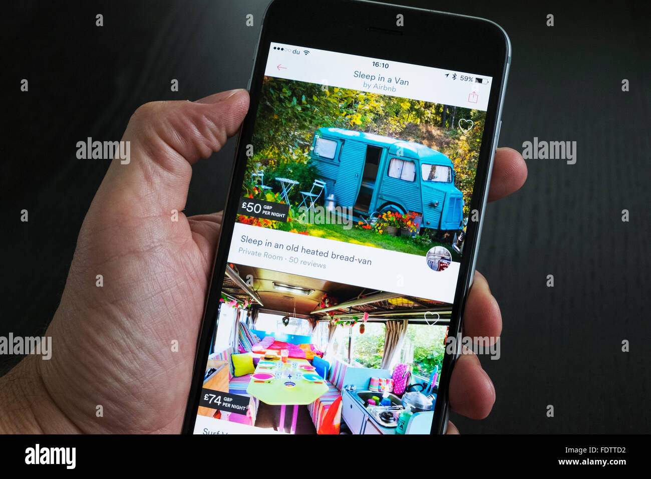 Airbnb holiday room booking app showing converted vans for rent on an iPhone 6 plus smart phone Stock Photo