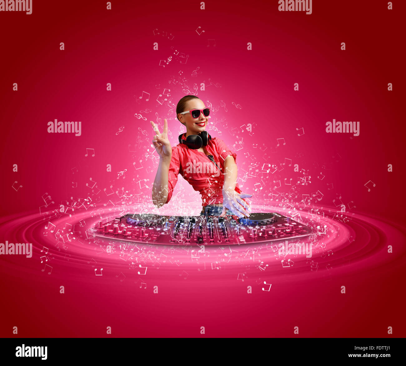 DJ with a mixer equipment to control sound and play music Stock Photo