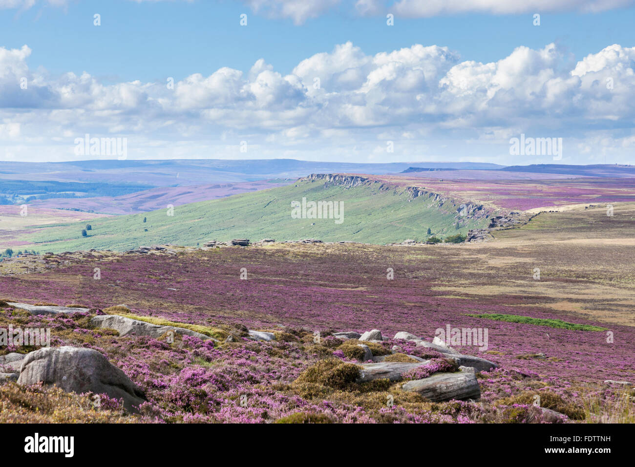 A view from moorland above Stanage Edge showing the curve of the gritstone escarpment. Derbyshire Yorkshire border, Peak District, England, UK Stock Photo