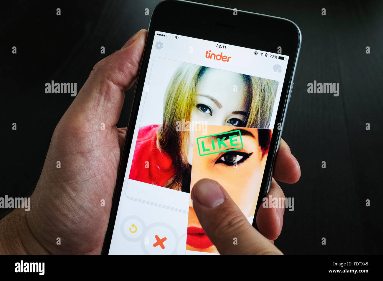 Tinder online dating app on a smartphone Stock Photo