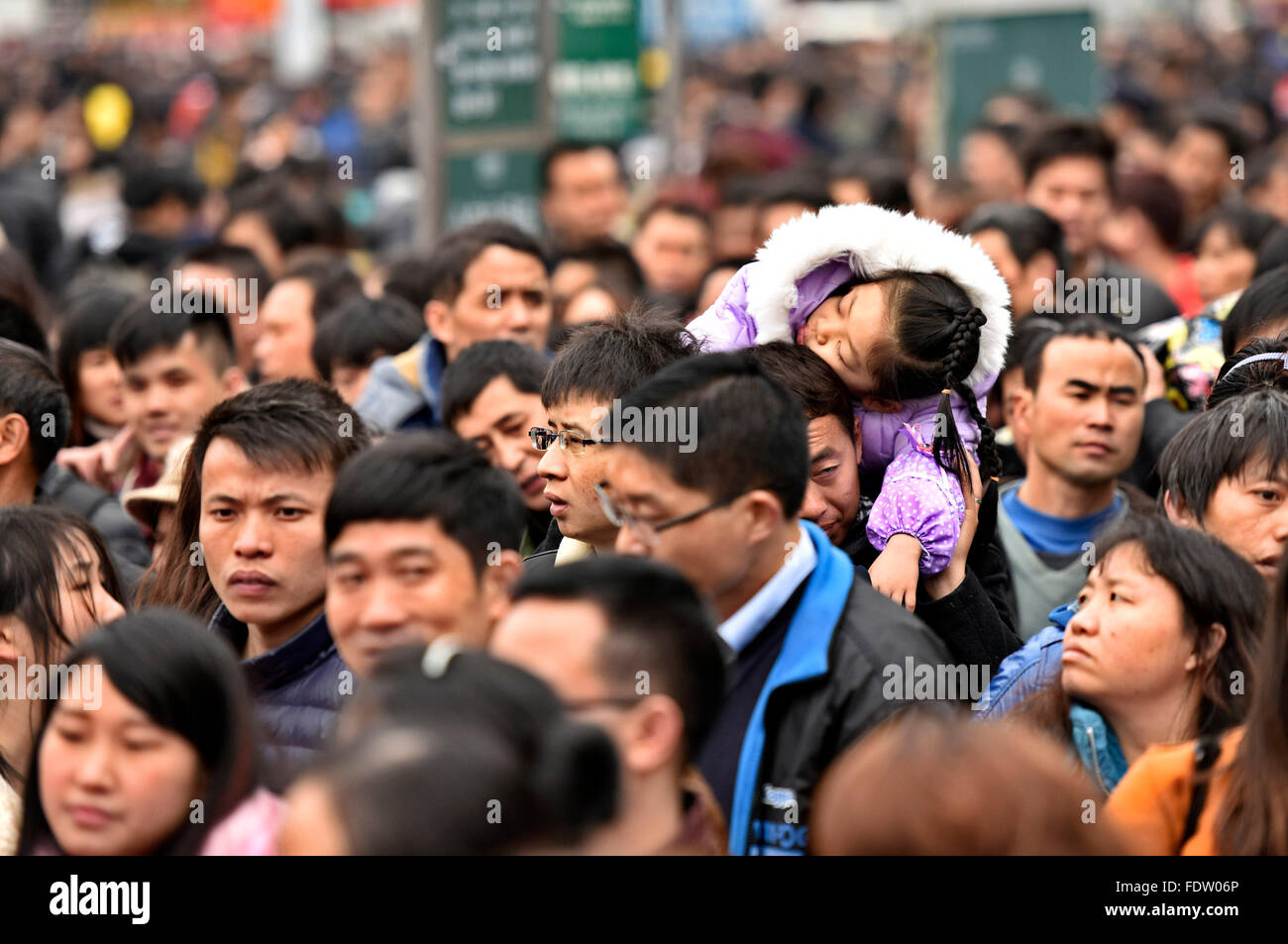 Guangzhou, China's Guangdong Province. 2nd Feb, 2016. Passengers rushing home for the coming Spring Festival, or the Chinese Lunar New Year, are seen stranded out of Guangzhou railway station in Guangzhou, south China's Guangdong Province, Feb. 2, 2016. Some 50,000 passengers were detained in the railway station due to delays of trains caused by continous bad weather. Credit:  Liu Dawei/Xinhua/Alamy Live News Stock Photo