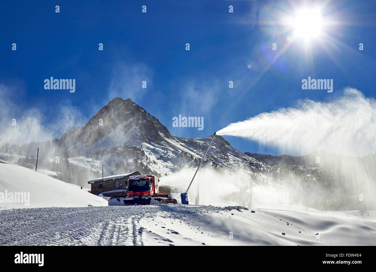 Red ratrack vehicle for snow preparation at ski resort in Pyrenees, Europe Stock Photo