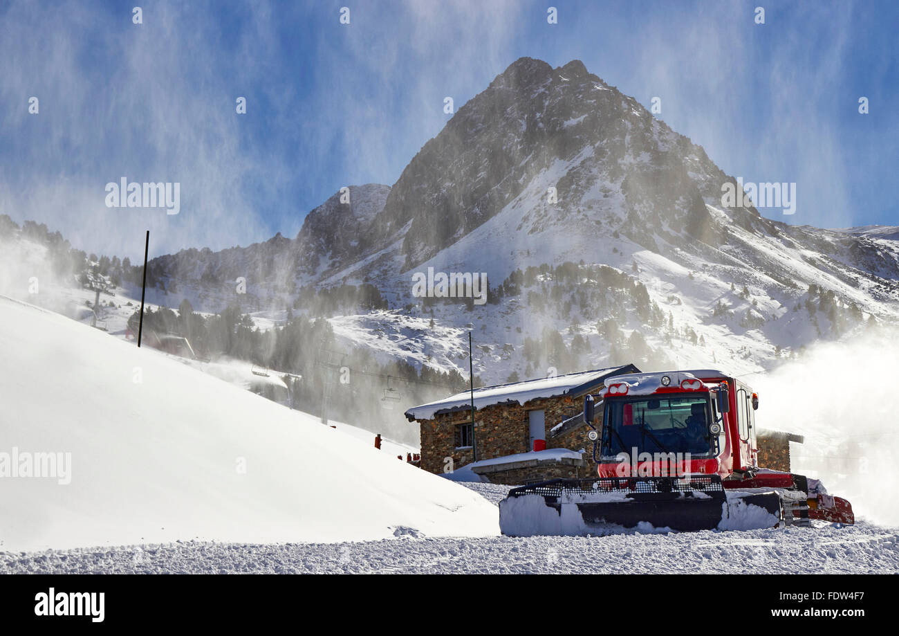 Red ratrack vehicle for snow preparation at ski resort in Andorra, Pyrenees, Europe Stock Photo