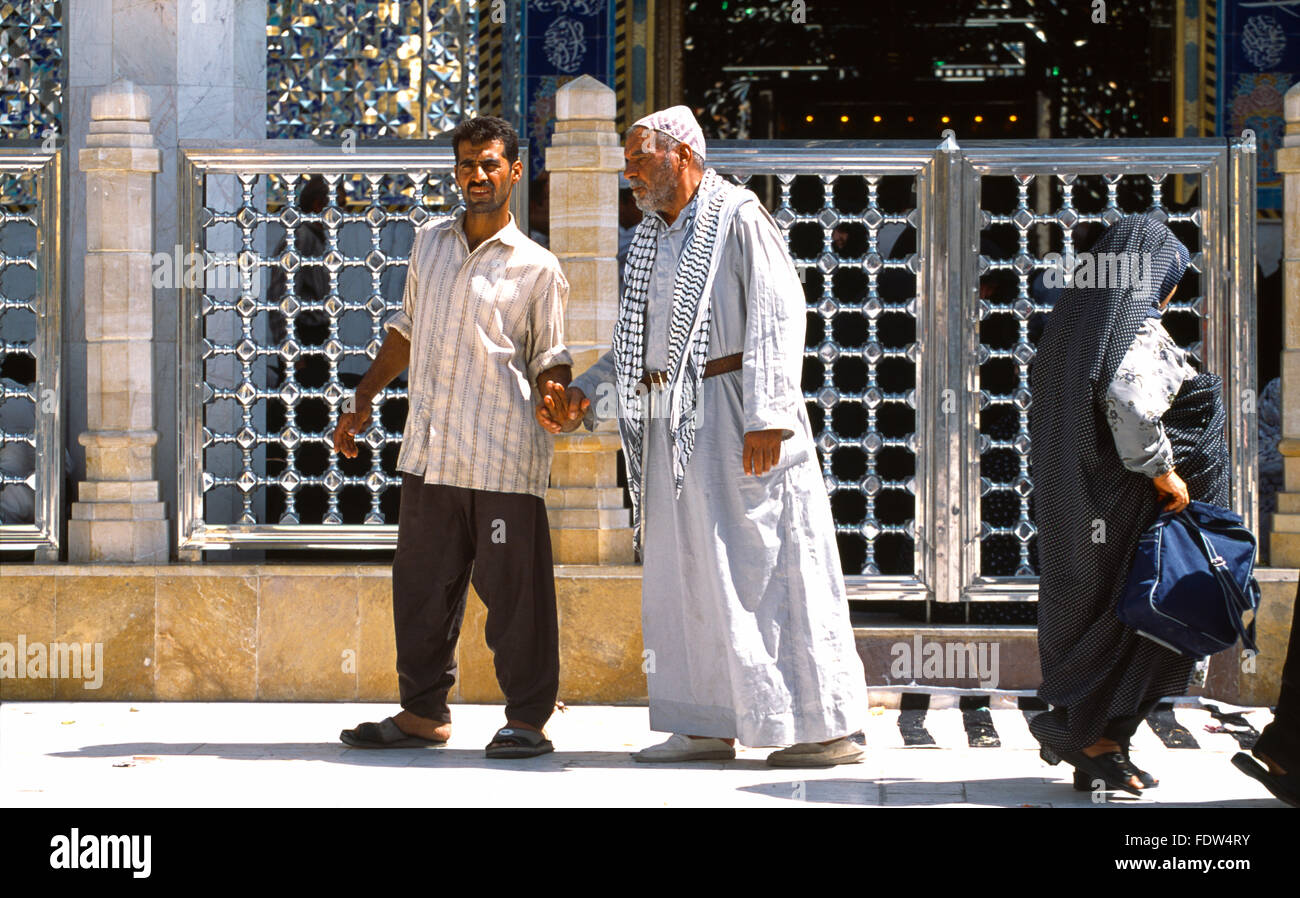 Samarra Iraq Two Men Holding Hands Outside Ali El Hadi Mosque Stock Photo