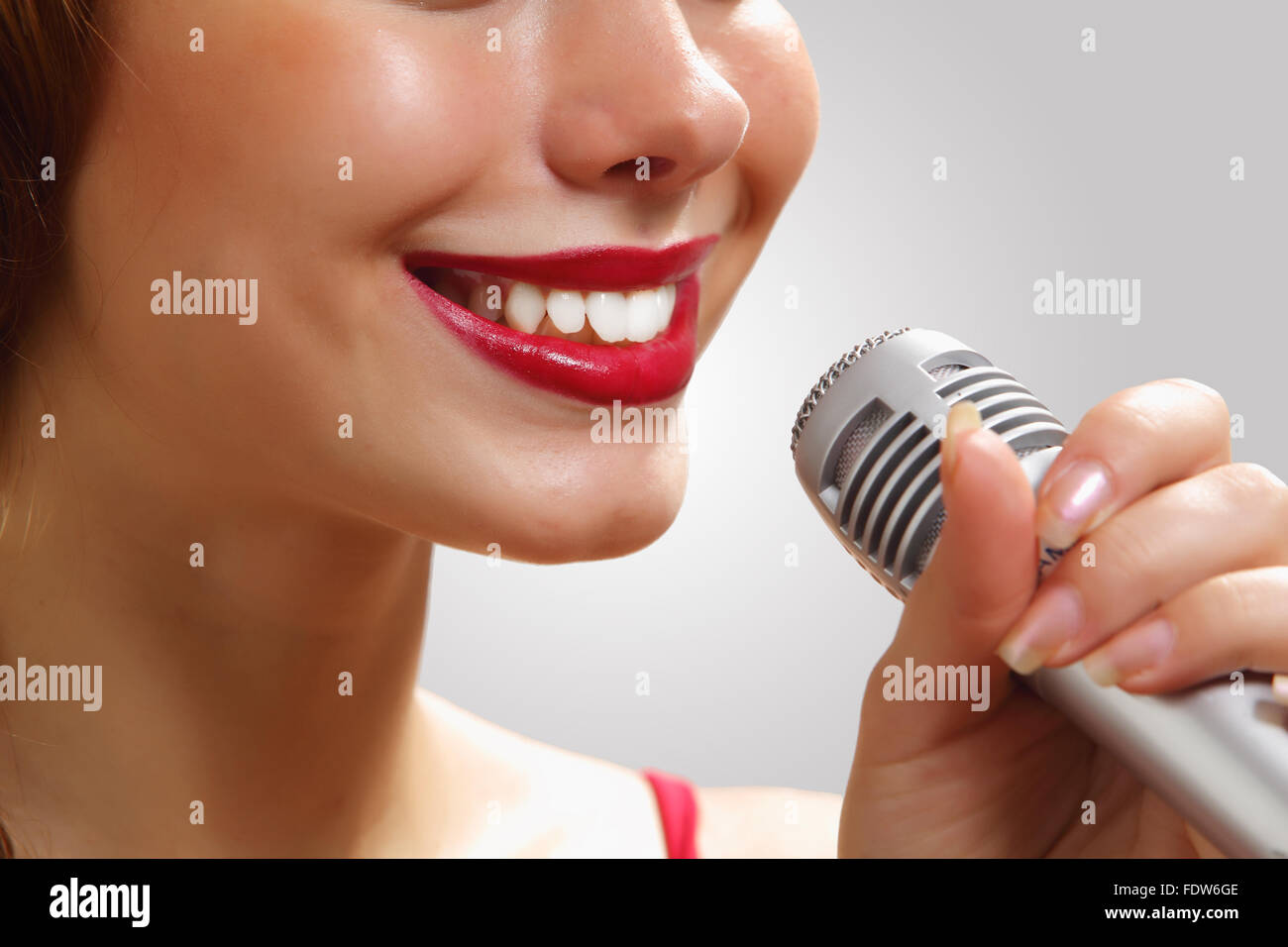Portrait of female rock singer with microphone Stock Photo - Alamy