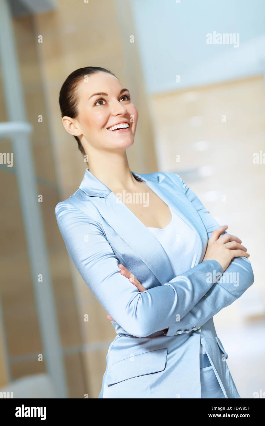Portrait of happy smiling young businesswoman in office Stock Photo - Alamy