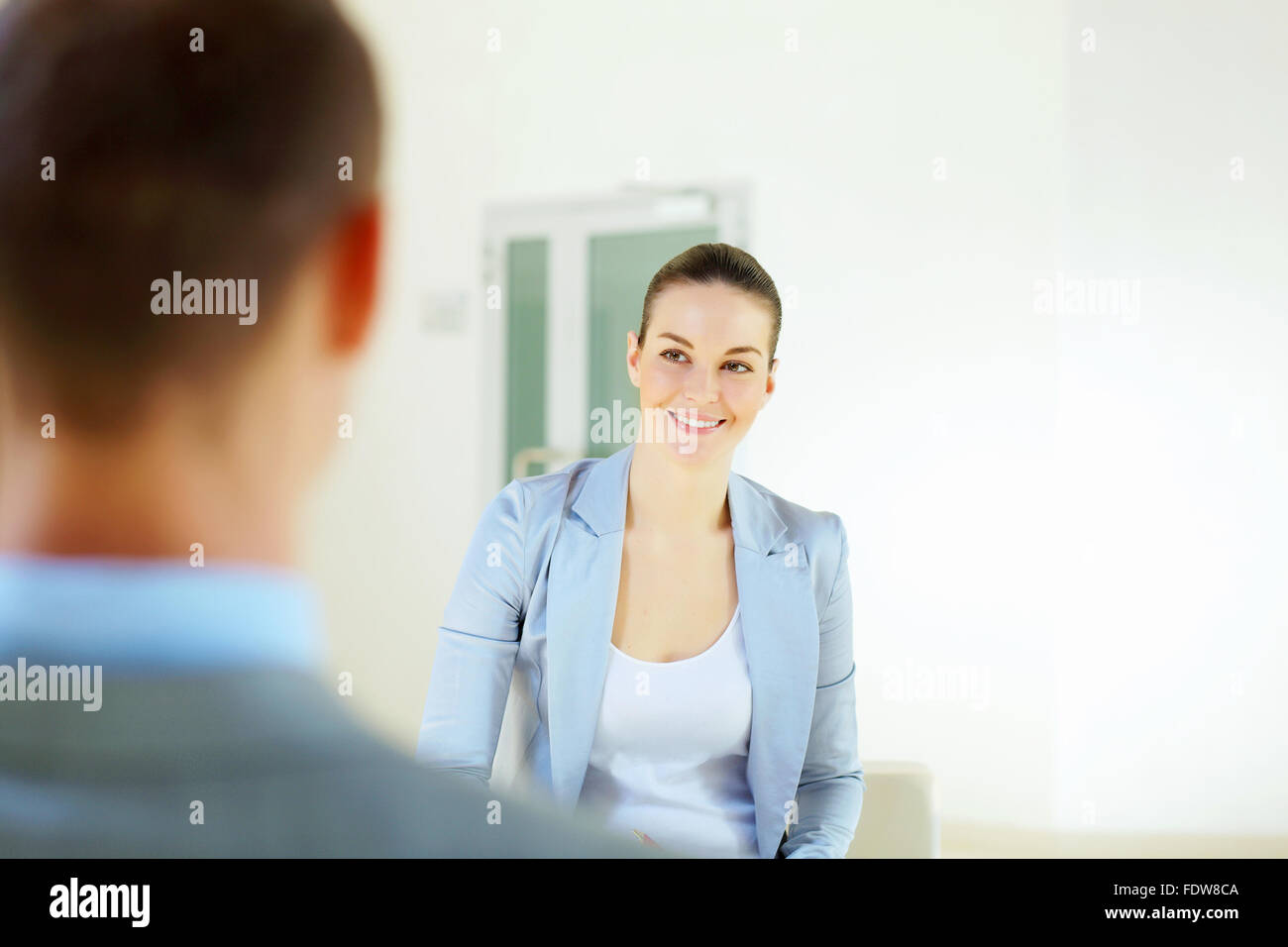 Portrait of happy smiling young businesswoman in office Stock Photo - Alamy