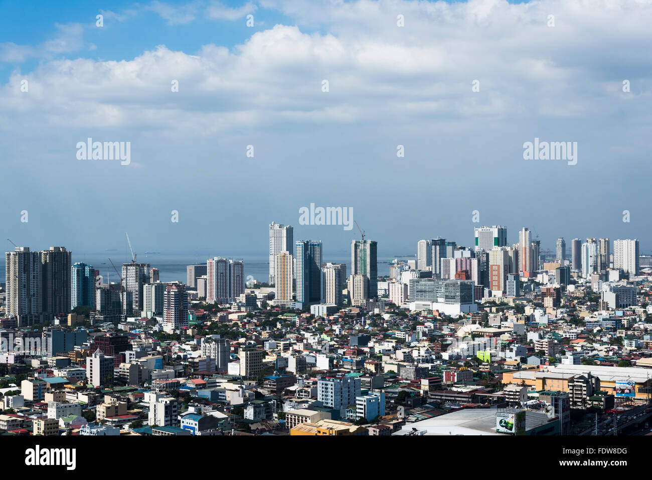 A view of the city and the skyscrapers overlooking Manila Bay in the Philippines Stock Photo