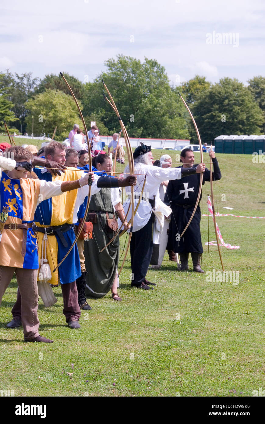 TEWKESBURY, GLOC. UK-11 JULY: Re-enactors in costume compete in longbow archery competition on 11 July 2014 at Tewkesbury Mediev Stock Photo