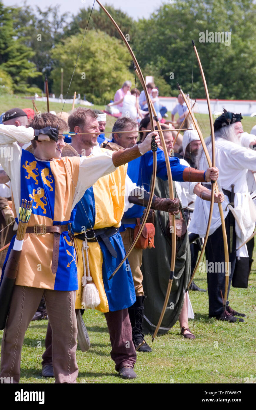 TEWKESBURY, GLOC. UK-12 JULY: Re-enactors compete in longbow archery competition on 12 July 2014 at Tewkesbury Medieval Festival Stock Photo