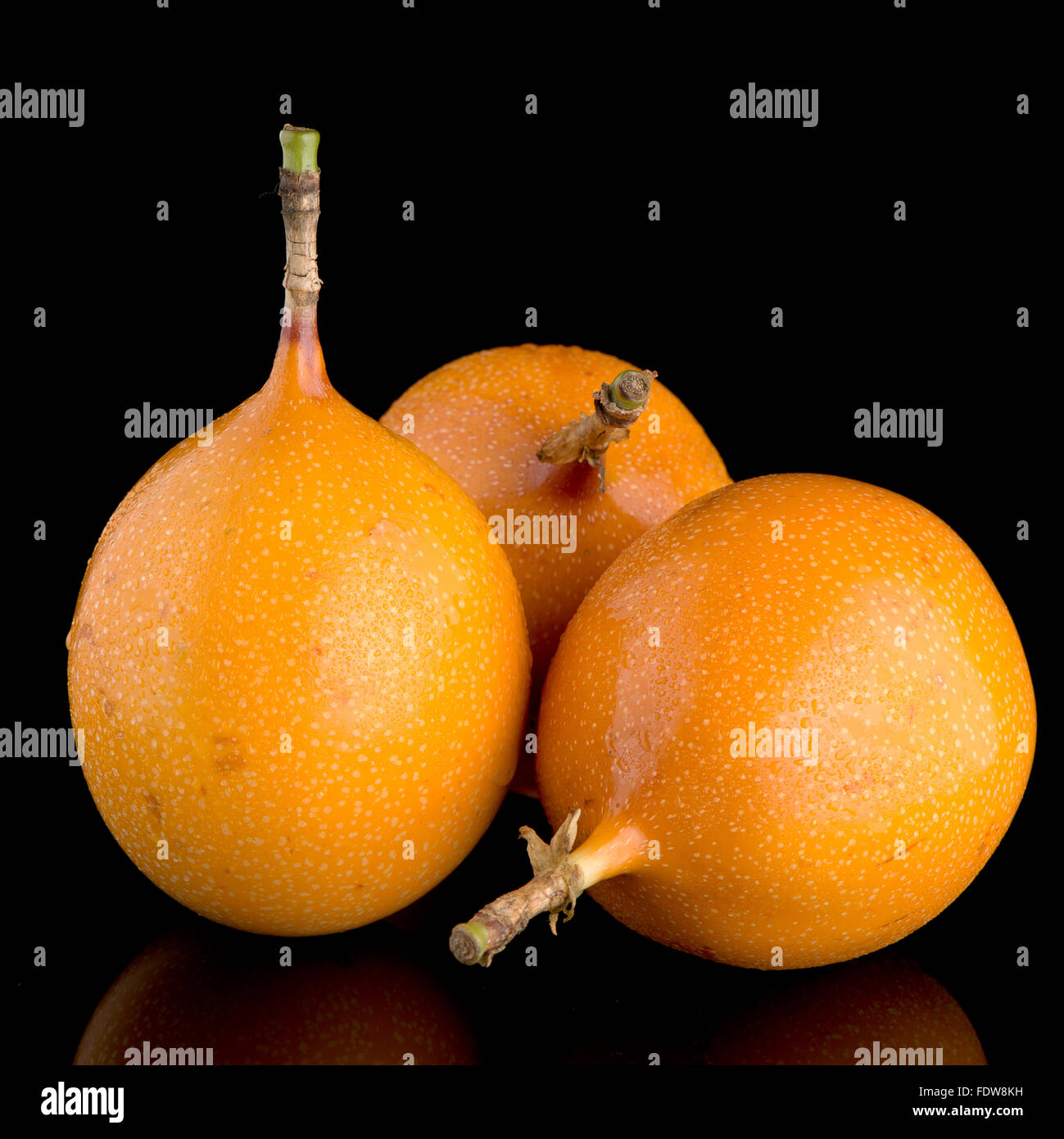 Passion fruit maracuja granadilla on black background Stock Photo - Alamy