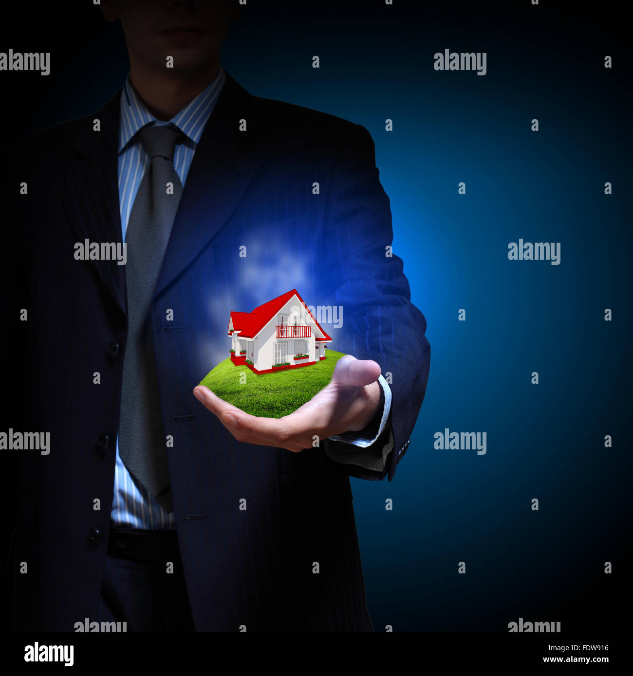 Residential building and a businessman holding it in his hands Stock ...