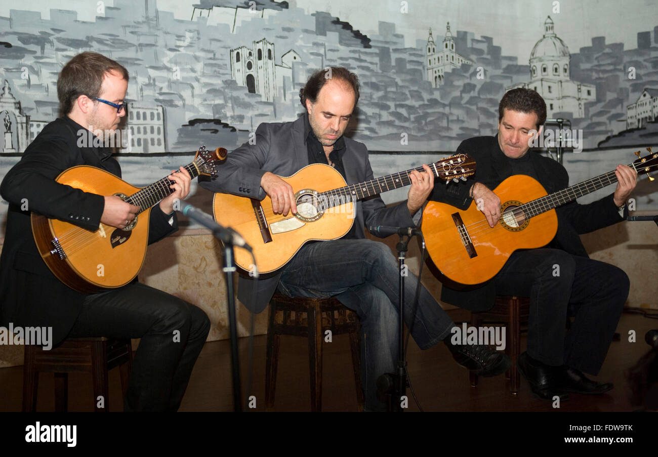 'Fado' - playing a traditional Portuguese guitar. Performing in a Lisbon café “Luso” - typical restaurant with fado and folklore Stock Photo