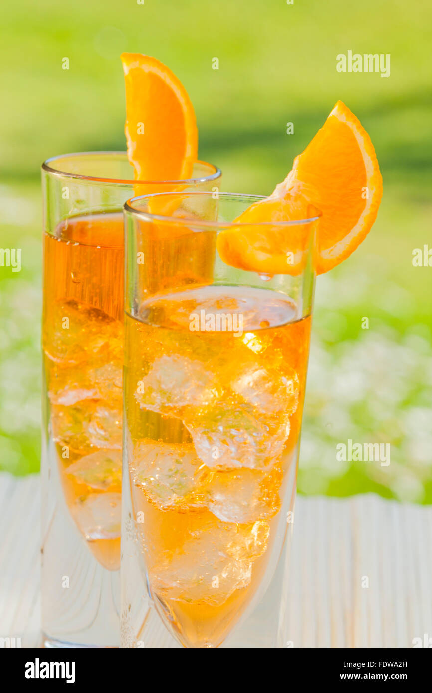 ice cold aperol spritz long drink in summer garden Stock Photo