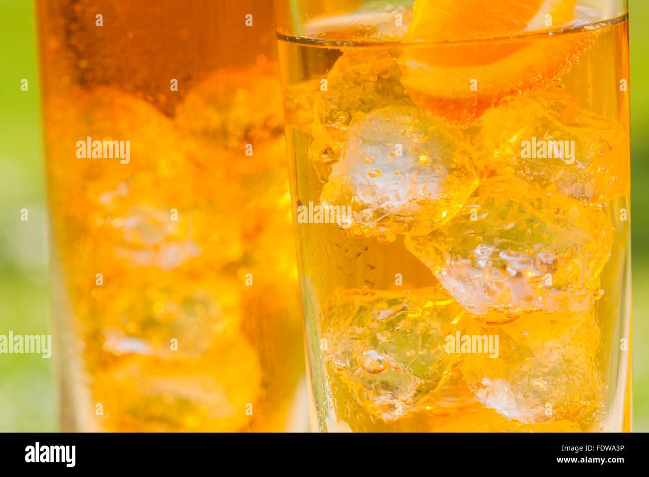 ice cold aperol spritz long drink in summer garden Stock Photo