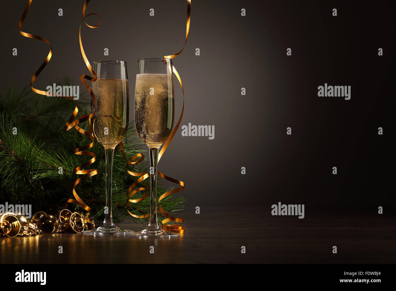 Two champagne glasses ready to bring in the New Year Stock Photo - Alamy