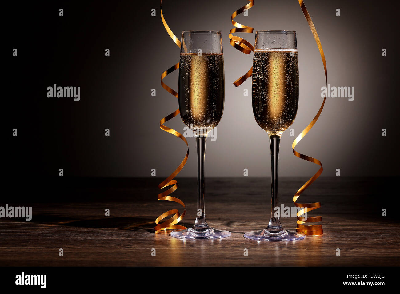 Two champagne glasses ready to bring in the New Year Stock Photo - Alamy