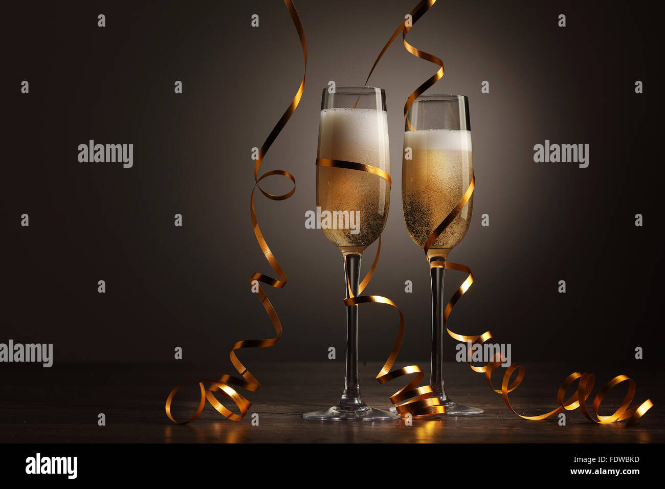 Two champagne glasses ready to bring in the New Year Stock Photo - Alamy