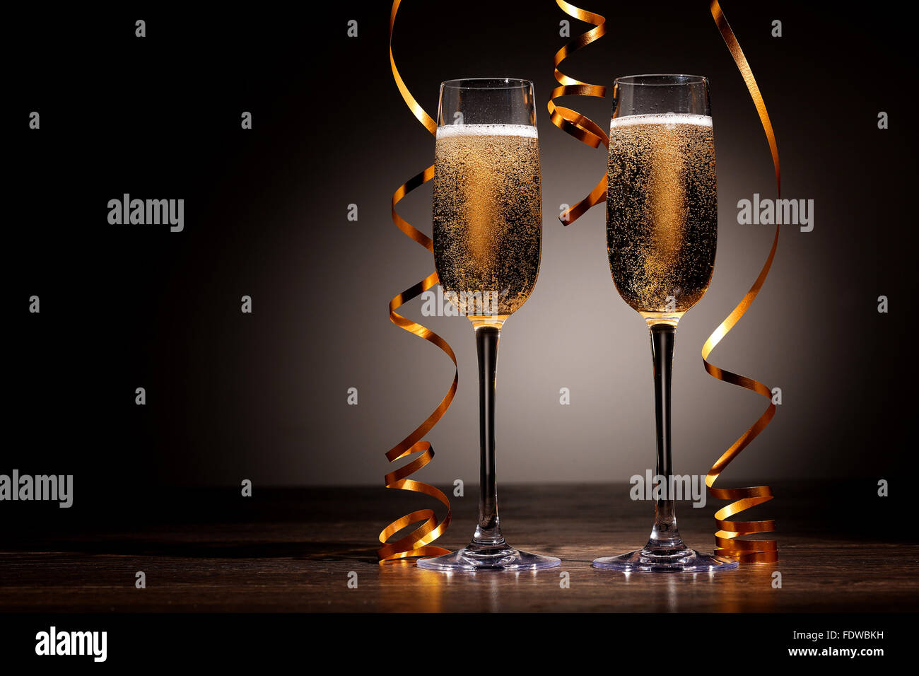 Two champagne glasses ready to bring in the New Year Stock Photo - Alamy
