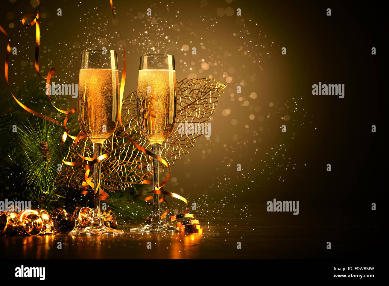 Two champagne glasses ready to bring in the New Year Stock Photo - Alamy