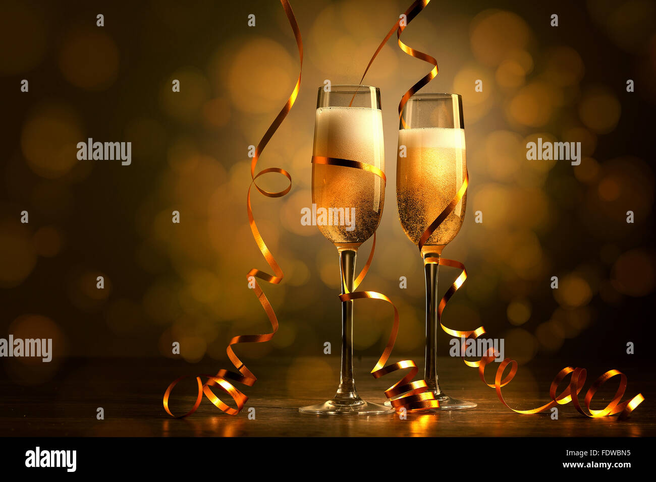 Two champagne glasses ready to bring in the New Year Stock Photo - Alamy