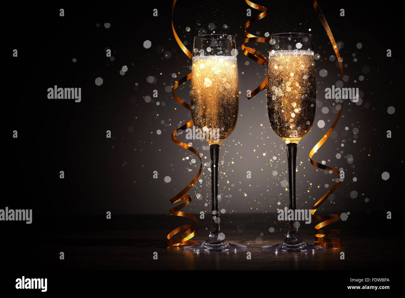 Two champagne glasses ready to bring in the New Year Stock Photo - Alamy