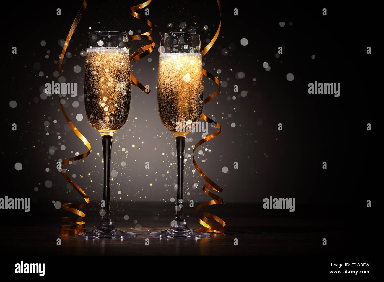 Two champagne glasses ready to bring in the New Year Stock Photo - Alamy