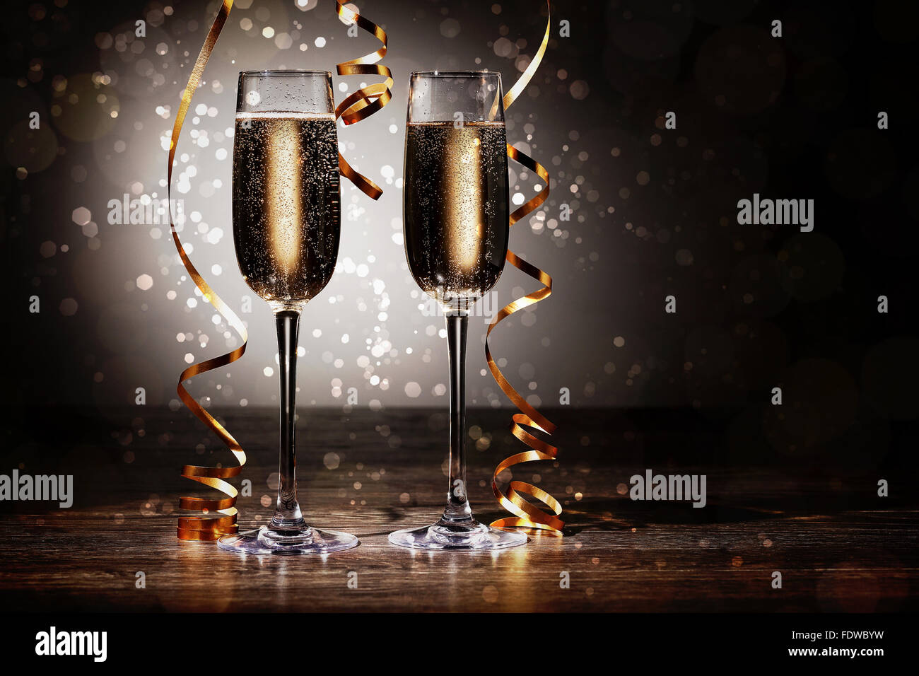 Two champagne glasses ready to bring in the New Year Stock Photo - Alamy