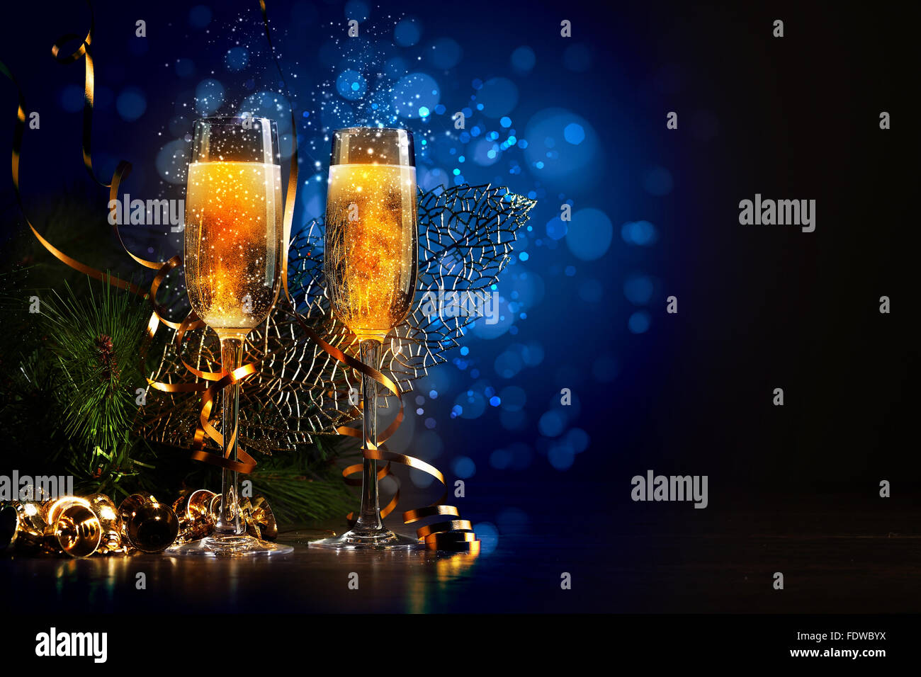 Two champagne glasses ready to bring in the New Year Stock Photo - Alamy