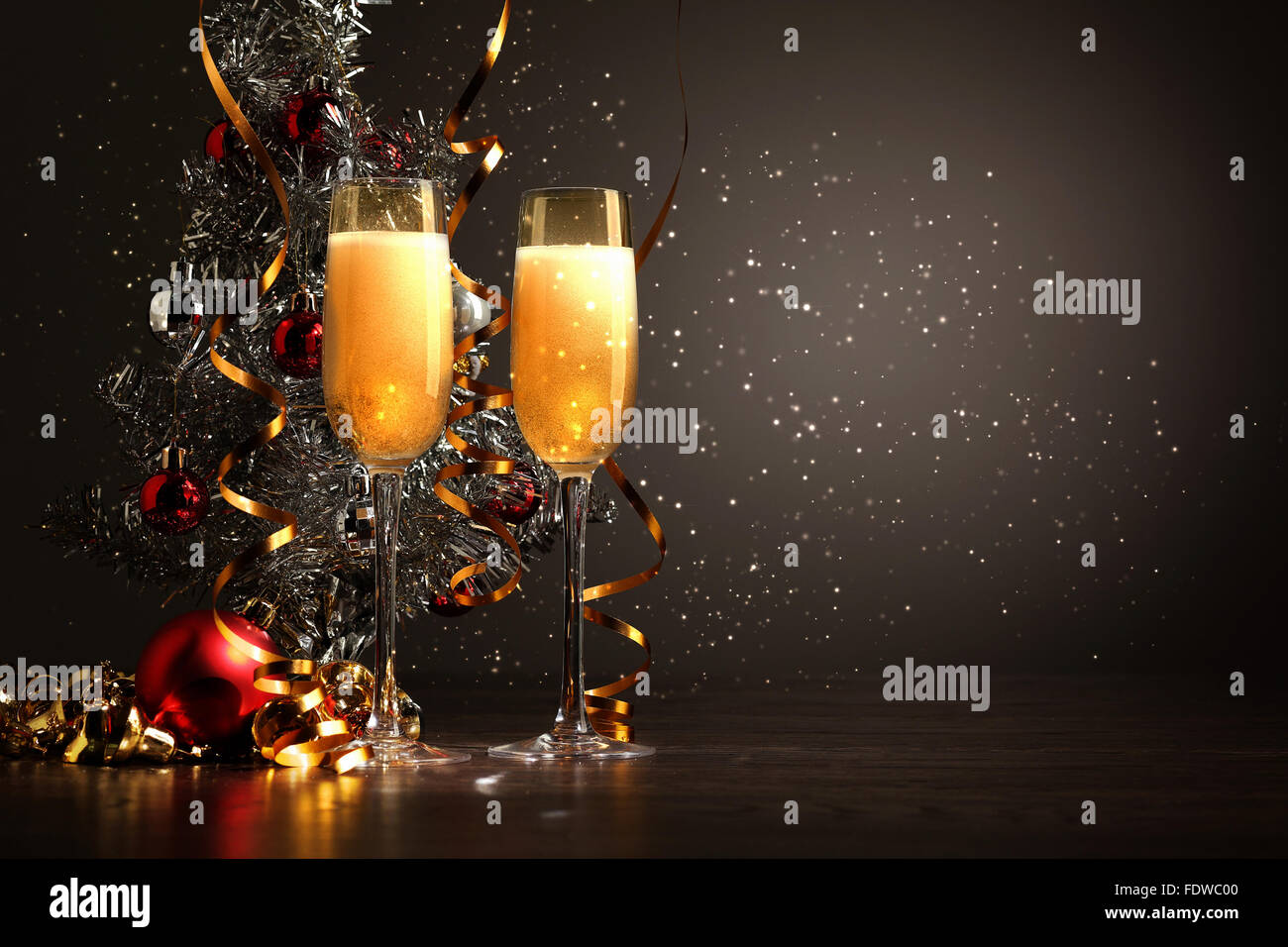 Two champagne glasses ready to bring in the New Year Stock Photo - Alamy