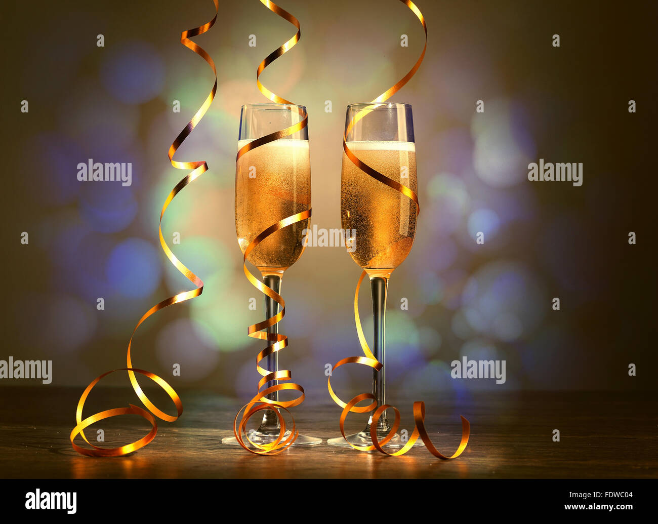 Two champagne glasses ready to bring in the New Year Stock Photo - Alamy